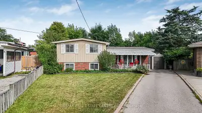 Welcome to this charming and spacious 3-level Side-split, ideally situated on a 34 x 129 ft pie-shap...