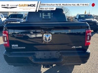 The 2023 Ram 2500 Laramie, in a striking black finish and equipped with a robust 4x4 drivetrain, pro... (image 3)