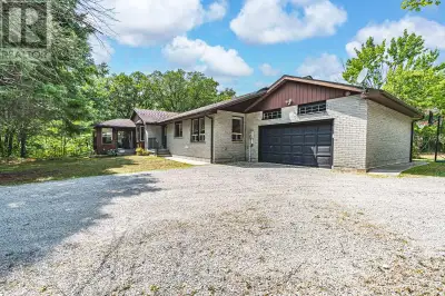 EXPERIENCE TRANQUIL LIVING IN THIS SPRAWLING BUNGALOW AMIDST NATURE'S BEAUTY ON 2.5 ACRES! This gene...