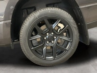 The 2026 Ram 1500 Sport, presented in a sophisticated gray finish, offers powerful 44 capabilities c... (image 8)