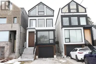 A rare architectural statement in the neighborhood. This custom-built three-story detached residence...