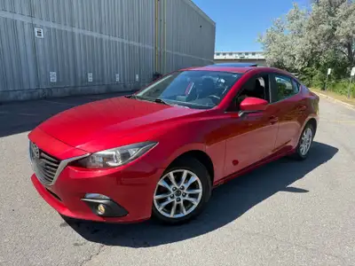 2014 Mazda3 Sedan Automatic – $6,990 Safetied • Two Keys • Sunroof Beautiful red exterior with a cle...