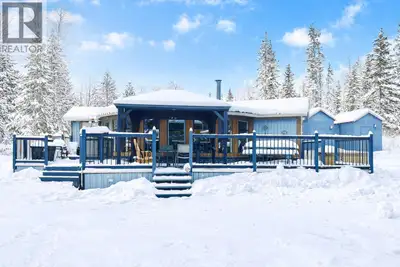 Just steps from the stunning shores of Green Lake, this bright four-season retreat or year-round hom...