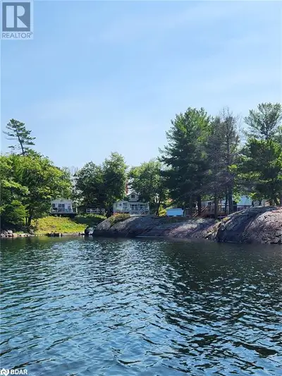 SPECTACULAR WATERFRONT COTTAGE WITH PANORAMIC VIEWS & UNMATCHED PRIVACY! Welcome to the serenity of...