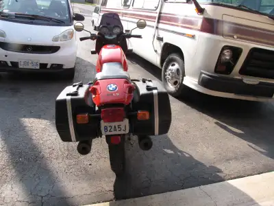 A real chick magnet, this BMW R65 LS with its beautiful red color. It comes with a small windscreen...