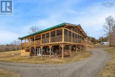 Set on 10.9 acres of useable land just 10 minutes from the village of Baddeck, this unique Big Harbo...