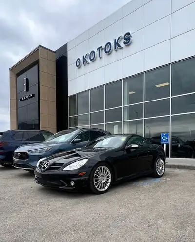 Our Accident Free 2007 Mercedes-Benz AMG SLK 55 Roadster is stunning in Black! Powered by a 5.5 Litr...