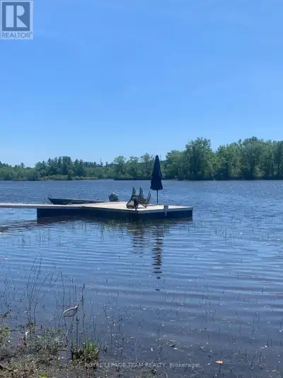 Location Location Location! Discover this beautiful waterfront property in the charming community of...