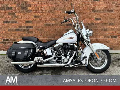 Beautiful Canadian Heritage Softail with a custom handlebar and custom grips, Arlen Ness high flow a...