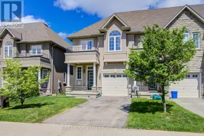 Fantastic Freehold Townhome with No Condo Fees! Rare find 115-ft extra deep lot! End Unit! Walk-out...
