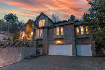 This grand Glenn Mountain Castle in the sky, is a stately executive home w inspired modern French co...