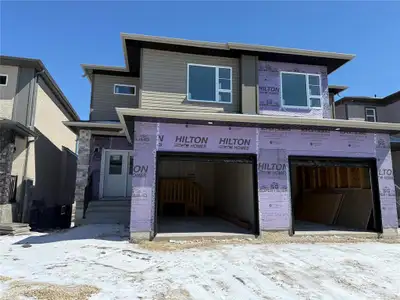 1R//Winnipeg/Welcome to a brand new 1,600 SF two-storey side-by-side home in Prairie Pointe with wal...