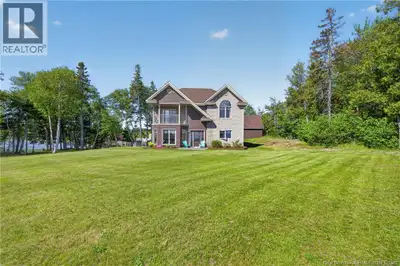 A Custom Waterfront Retreat offering stunning views, a thoughtfully designed layout and exceptional...