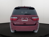 Experience the ultimate fusion of muscle-car attitude and three-row utility in this aggressive SUV,... (image 4)
