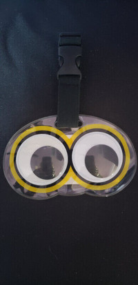 Luggage Tag, Rolling moving eyes, secure clip, 5" X 3" NEW