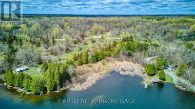 Tucked away on the shore of beautiful Sand Lake, this 5.7 acres is the perfect place for your waterf...