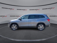 This used 2018 Honda Pilot Touring AWD is a roomy, family-ready SUV with smart features and proven V... (image 4)