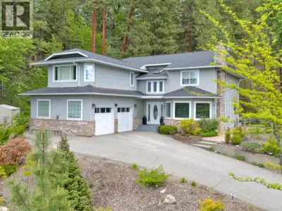 Embrace Serene Living on the Naramata Bench! Perched in the mountains & surrounded by acres of conse...