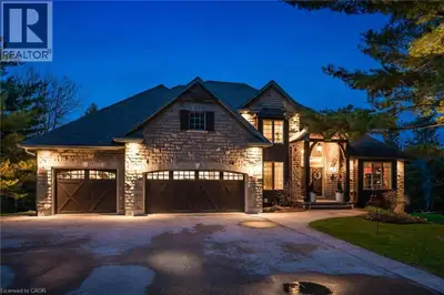 Perched alongside the tranquil Irvine River on nearly 3/4 of an acre at the end of a private road, 4...