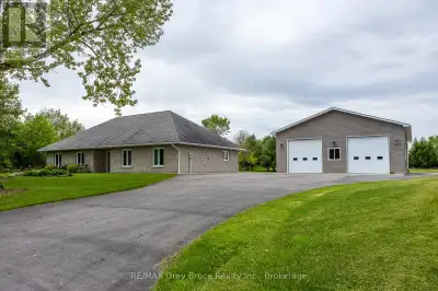 Discover the comfort and convenience of country living in this well-maintained ranch-style bungalow,...