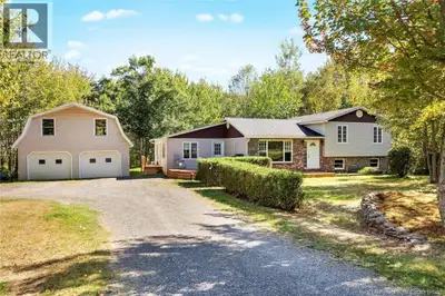 Just steps from Grand Lake, this unique side-level split home offers a functional, spacious layout i...