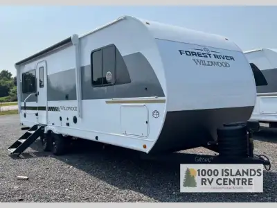 Forest River Wildwood travel trailer 22ERAS highlights: Rear Kitchen Walk-Through Bathroom Swiveling...