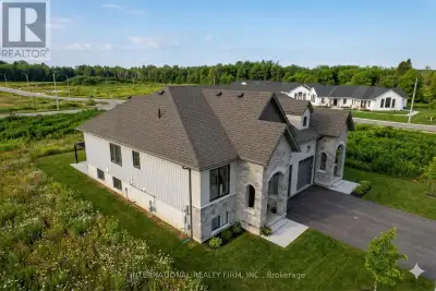 Turn-key semi-raised bungalow for sale! Professionally built by award-winning builder LeBlanc, this...