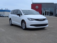 The 2026 Chrysler Grand Caravan SXT in Bright White with a Black interior combines modern styling, e... (image 8)
