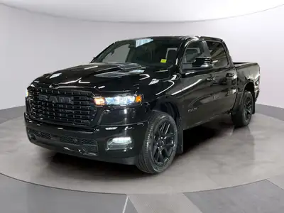 The 2026 Ram 1500 Sport, in a striking black finish, offers outstanding performance with its 4x4 dri...