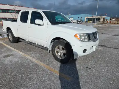 2010 Nissan Frontier 4.0L automatic transmission. Only 231,000kms and counting as it's daily driven....