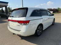 2014 Honda Odyssey Touring — White exterior, Brown interior. This Odyssey is powered by a 3.5L V6 th... (image 6)
