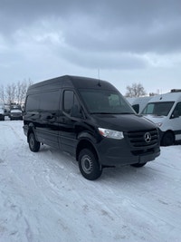 black-on-black Mercedes-Benz Sprinter van. This well-maintained vehicle offers a blend of luxury and... (image 3)