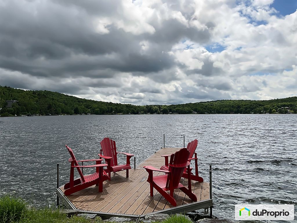 $998,500 - Cottage for sale in Lac-Poulin — photo 1