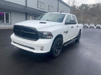 The 2022 Ram 1500 Classic Express, presented in a pristine white finish, is equipped with a robust 4... (image 1)