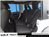 The 2022 Jeep Wrangler Unlimited Willys 4x4 in a classic white exterior and rugged 44 drivetrain is... (image 8)