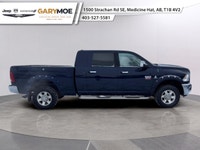 Experience the robust power and commanding presence of the 2012 Ram 3500 Laramie with its stunning d... (image 1)