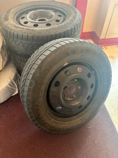 Four winter tires 225/65-R17 on steel rims. More than 70% left. Came from Dodge Grand Caravan 2015