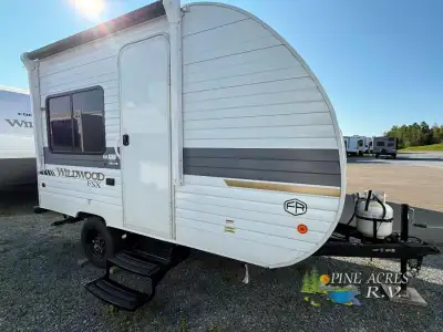 Forest River Wildwood FSX travel trailer 135ICE highlights: Walk-In Shower 12V Refrigerator Overhead...