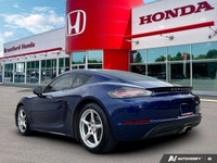 Feel the exhilaration of the open road with this stunning 2020 Porsche 718 Cayman in vibrant Gentian... (image 3)