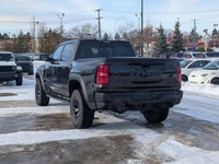 The 2026 Ram 1500 RHO Crew Cab in Diamond Black Crystal Pearl delivers bold styling and high-perform... (image 3)