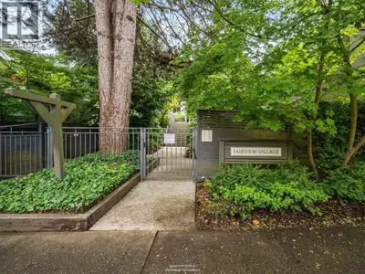 Fairview Village townhouse with views, outdoor space, and design potential. Enjoy mountain and downt...