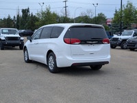 The 2026 Chrysler Grand Caravan SXT in Bright White with a Black interior offers a perfect balance o... (image 3)