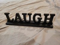 Black Wooden Laugh Sign