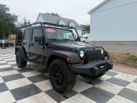 A rugged four-door SUV with iconic styling, manual transmission, and strong 4x4 capability, offering... (image 2)