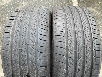 a Nice PAIR of Michelin performance all season tires with Tons of tread (2 TIRES ONLY) size 255/40/2...