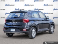 Discover the 2020 Hyundai Venue Preferred: a sleek, black subcompact SUV designed for urban adventur... (image 4)