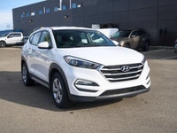 This Hyundai Tucson boasts a Regular Unleaded I-4 2.0 L/122 engine powering this Automatic transmiss... (image 6)