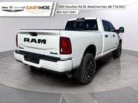 Introducing the 2026 Ram 2500 Big Horn 4x4 Crew Cab with a 64 Box in a vibrant white exterior paired... (image 2)