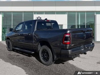 This 2021 Ram 1500 Sport Crew Cab, striking in Granite Crystal Metallic, stands ready for action, bo... (image 2)