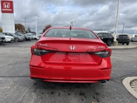 Command attention in this vibrant Rallye Red 2022 Honda Civic Sedan Sport, engineered to make every... (image 5)